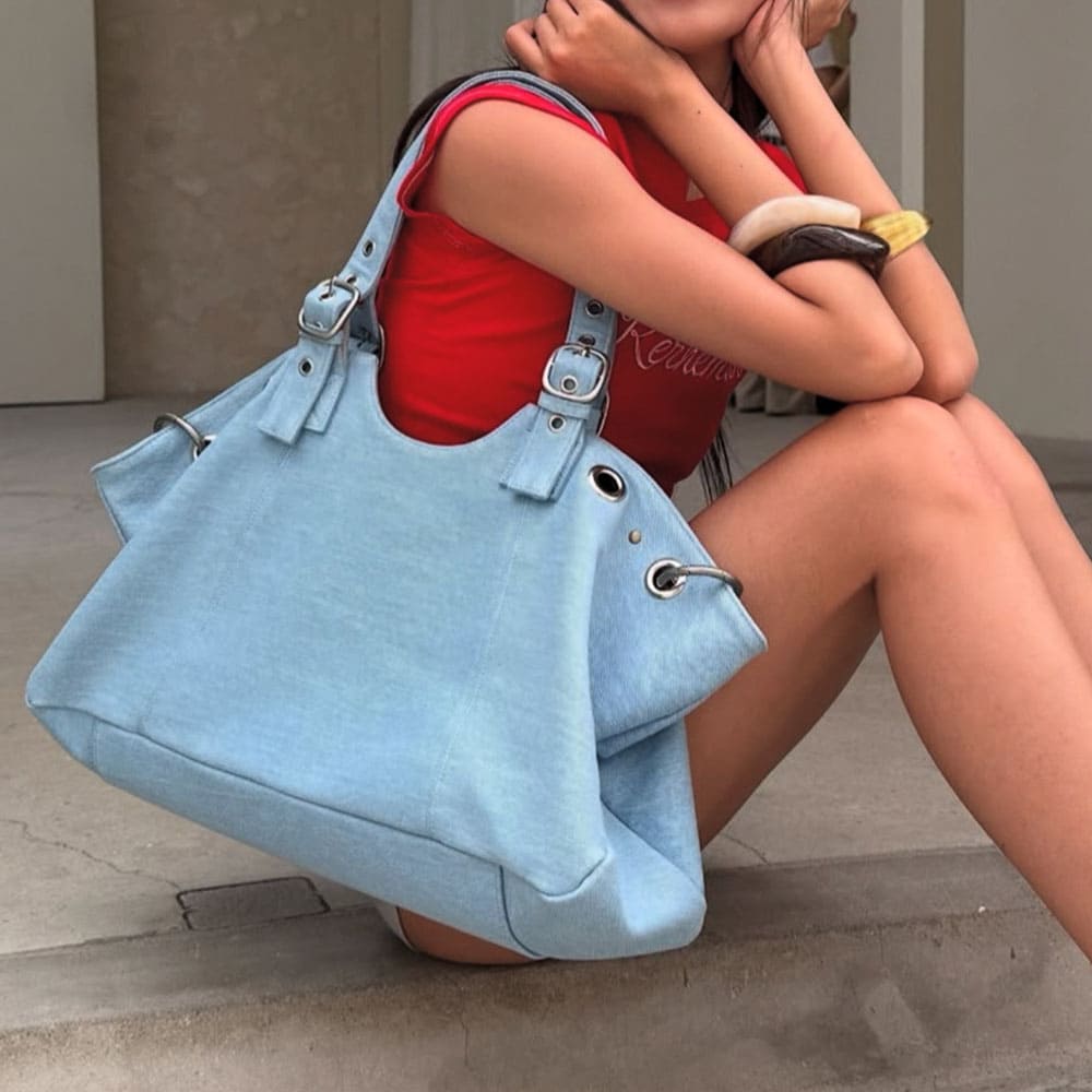 Icon Behavior Grommet Shoulder Bag